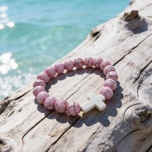 Pink 8mm beads. This bracelet caters to small wrists. Young teens and or adults